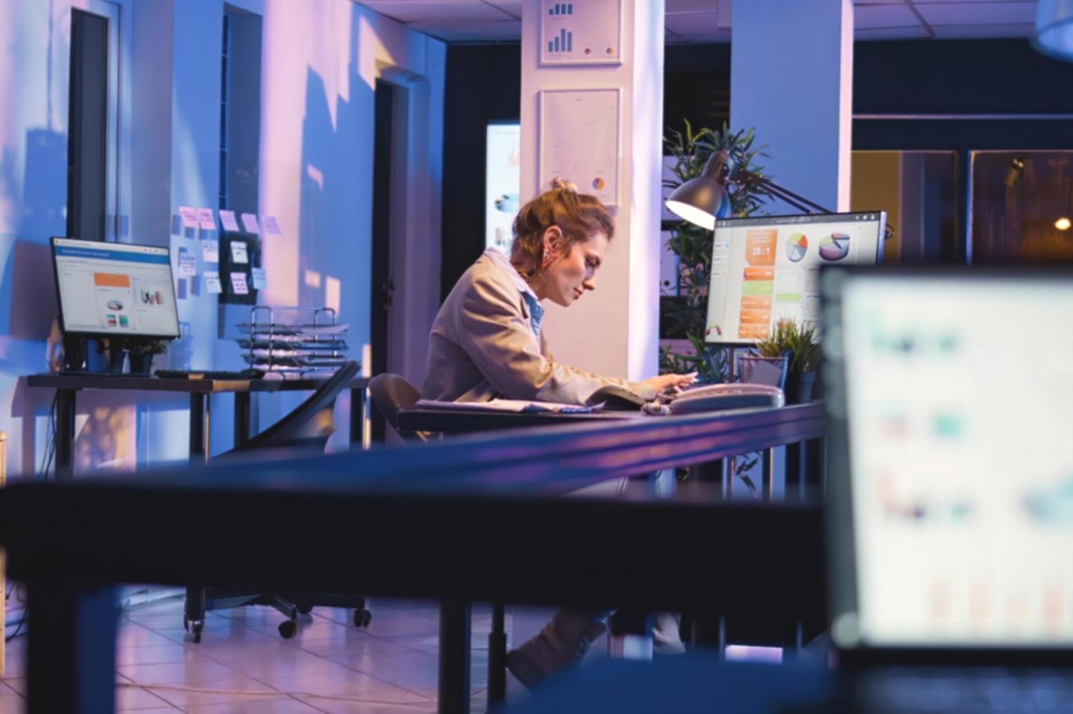 Marketing professional working with AI tools on screen